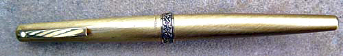Lady Sheaffer 630 - Made in USA. Brushed golden colour lacquered finish, gold plated Florentine band and clip, fitted with a 14ct gold TRIUMPH BROAD/MEDIUM RECESSED NIB. NOS, NEVER INKED. 